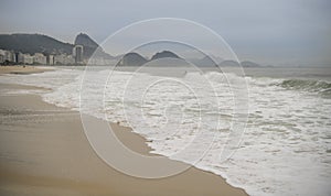 Ocean surf on the beach of Copacabana. Rio de Janeiro, February 2020