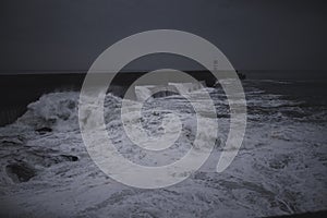 Ocean surf at the pier on a winter overcast.