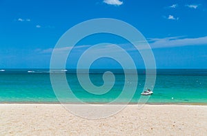 The ocean is turquoise and the boat is far away. Thailand. Samui. Gulf of Thailand. Lamai Beach