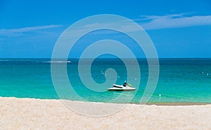 The ocean is turquoise and the boat is far away. Thailand. Samui. Gulf of Thailand. Lamai Beach