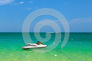 The ocean is turquoise and the boat is far away. Thailand. Samui. Gulf of Thailand. Lamai Beach