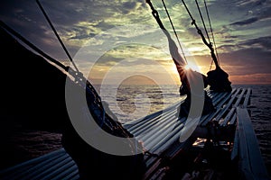 The ocean view from the bow of a sailing ship on the beautiful sunsets