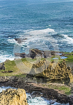 Ocean view with rocky island in the foreground