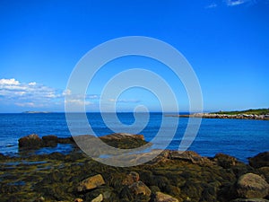 Ocean view from a rocky shore photo