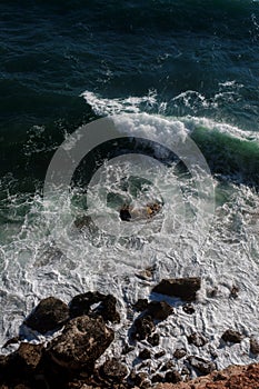 Ocean wave background breaking sea water rocky shore