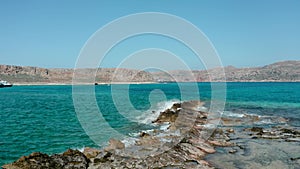 Ocean wave background breaking sea water rocky shore rough seas turquoise water gradient foam,