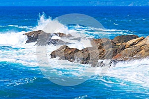Ocean Wave batters rock