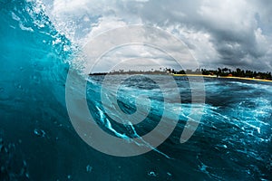 Ocean wave breaking on reef shore