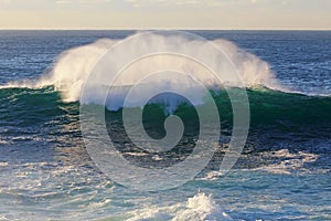 Ocean wave breaks