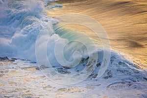 Ocean wave close up at sunset