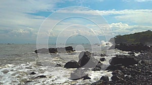 Ocean Wave Crashing Into Rocky Beach Coastline. Rock on Seashore of Loji Beach at Ciletuh