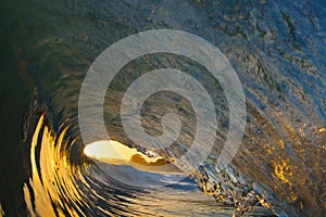 Ocean Wave Tube at Sunset on the Beach in California