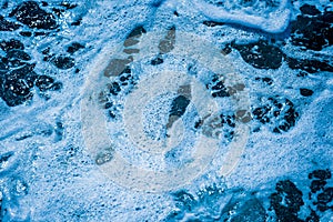 Ocean wave water sea of rippled water with white wave bubbles near the big boat on summer