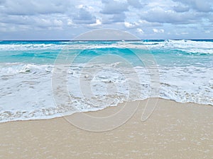 Ocean waves on the beach. Cancun, Mexico