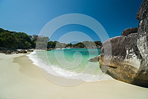 Ocean waves, Beautiful tropical beach and rocky coastline and beautiful forest. Nga Khin Nyo Gyee Island Myanmar. Tropical seas photo