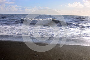 Ocean with waves on a black beach, Iceland