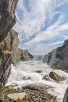 Ocean waves crashing against a rocky shore