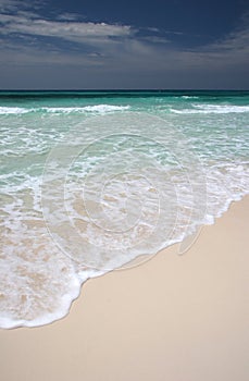 Ocean waves crushing on beach.