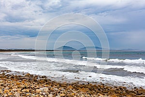 Ocean waves crushing on the Crowdy Bay beach. photo