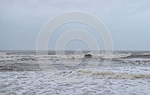 Ocean with Waves and High Tide with Cloudy Sky in Monsoon and Vayu Cyclone Storm - Seascape Background Wallpaper