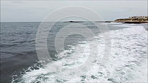 Ocean with waves and sand at the monica beach in Morocco, Aerial view 4K of drone