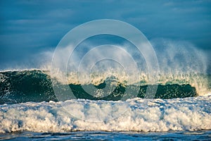 Ocean waves. Stormy weather, clouds sky background. Seascape.