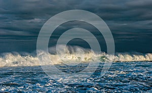 Ocean waves. Stormy weather, clouds sky background. Seascape.