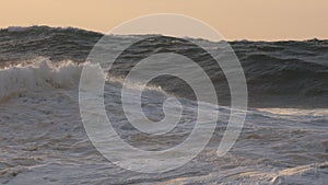 Ocean waves, sunset photo