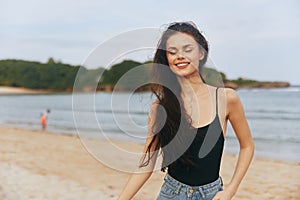ocean woman vacation lifestyle copy-space beach summer sand sunset smile sea