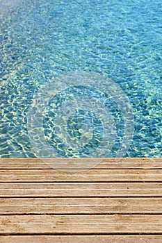 Ocean with wood boardwalk deck blue sea copy space vertical