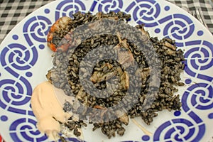 Oceanic Elegance: Black Rice Delight with Calamari and Prawns