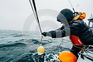 Oceanographer Deploying Weather Buoy at Sea. Generative ai