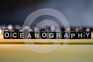 OCEANOGRAPHY concept wooden blocks on the table.