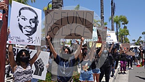 Oceanside, CA / USA - June 7, 2020: People hold signs during peaceful Black Lives Matter protest march