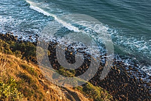 Oceran waves breaking on the rocky beach