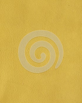 Ocher yellow leather texture background photo