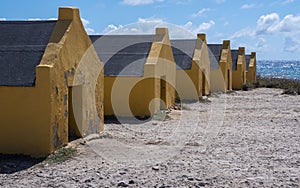 Ocher yellow slave houses on the south side of Bonaire.