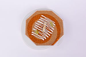 Octagon-shaped Knafeh dessert isolated on a white background