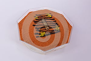 Octagon-shaped Knafeh dessert isolated on a white background