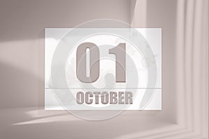 october 01. 01th day of the month, calendar date.White sheet of paper with numbers on minimalistic pink background with