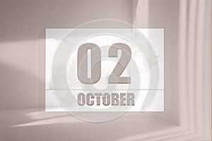 october 02. 02th day of the month, calendar date.White sheet of paper with numbers on minimalistic pink background with