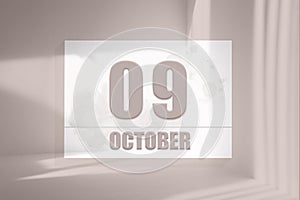 october 09. 09th day of the month, calendar date.White sheet of paper with numbers on minimalistic pink background with