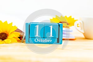 October 11 on the wooden calendar.The eleventh day of the autumn month, a calendar for the workplace.
