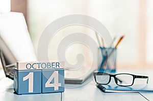 October 14th. Day 14 of month, calendar on Engineer workplace background. Autumn time. Empty space for text