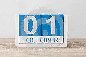 October 1st . October 1 white and blue wooden calendar on light wood abstract background. Autumn day