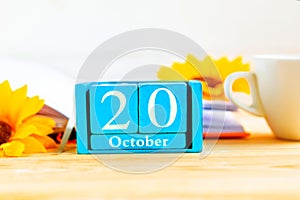 October 20 on the wooden calendar. The twentieth day of the autumn month, a calendar for the workplace.