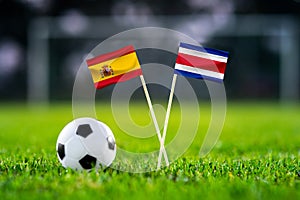 October 2022: Spain vs Costa Rica, Al Thumama Stadium, Football match wallpaper, Handmade national flags and soccer ball on green