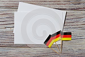 October 3 happy Day of German unity. the concept of patriotism , freedom and independence. Mini flags with a white card on wooden