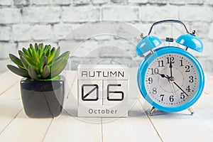 October 6 on the wooden calendar.The sixth day of the autumn month, a calendar for the workplace. Autumn