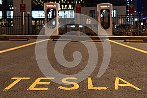 October 20, 2022 Astana, Kazakhstan: Empty Tesla electric car charging station against the backdrop of the city at night